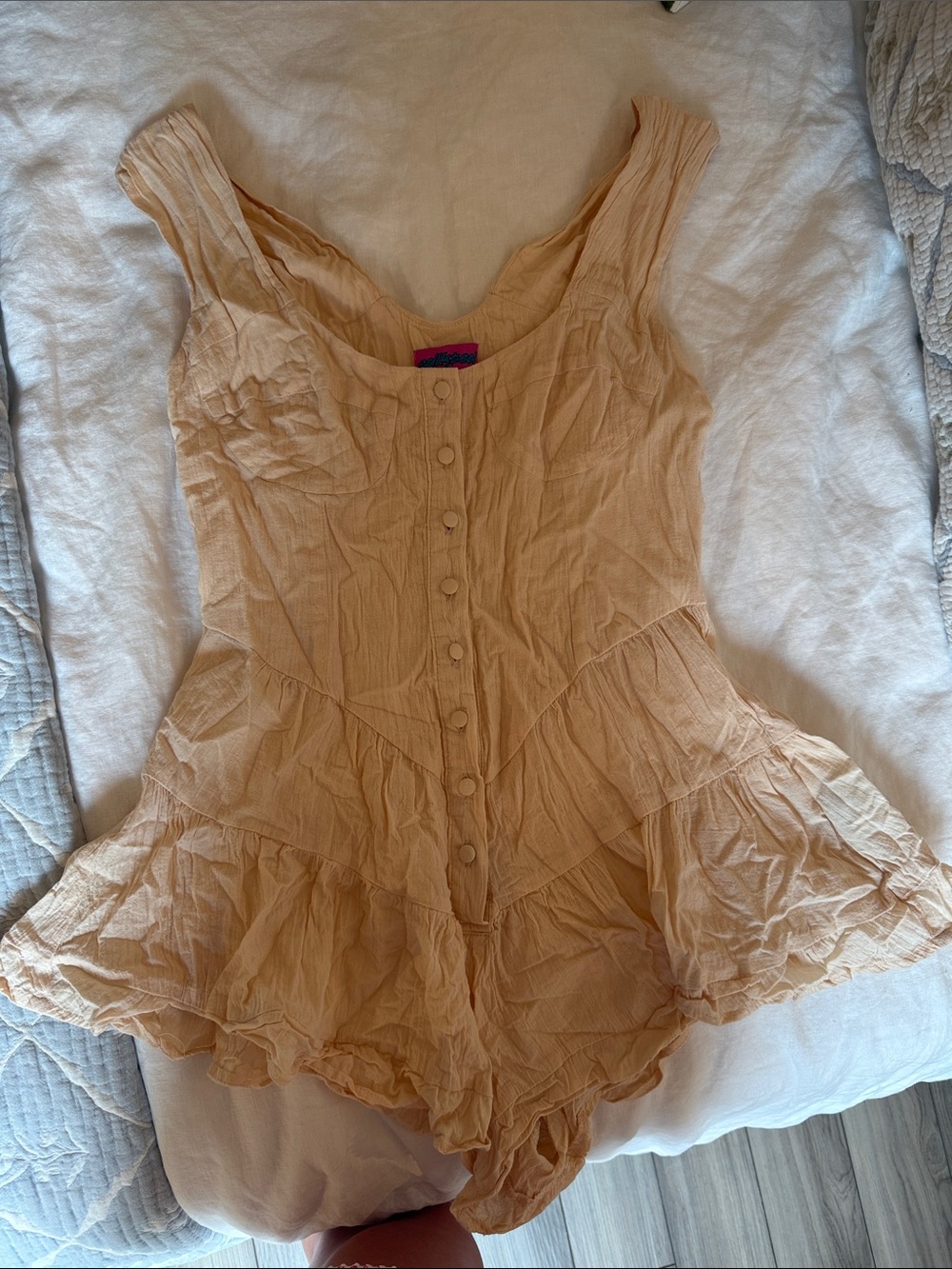 Button-Front Peach Romper with Ruffled Hem